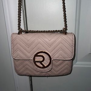 i’m selling this tiny/mini light pink crossbody purse. The brand is Rampage.